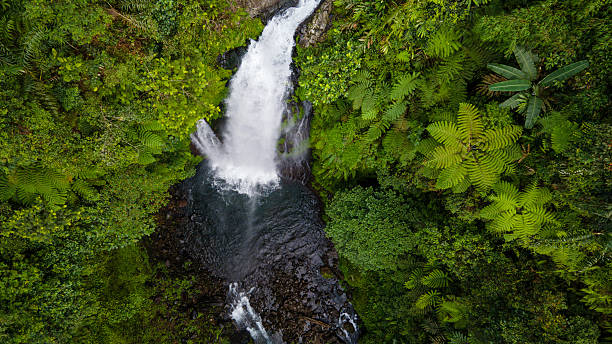istock Drone Photo of Waterfall in Dense Forest – Gomblang Waterfall from Above, Java Island, Indonesia 2251287568
