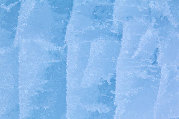 Texture of winter ice surface. Blue natural ice background.
