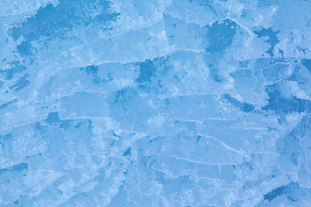 Winter closeup of an abstract blue ice pattern, Eagle Lake, Fort Custer State Park, Michigan, USA