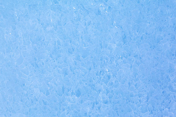 Texture of winter ice surface. Blue natural ice background.