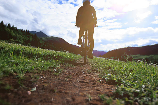 Silhouette of a man on mountain bike at sunset