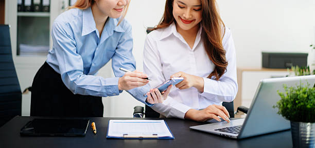 istock Team work process. Photo young business crew working with new startup project. Project managers meeting. Analyze plans, papers in office 2251296046