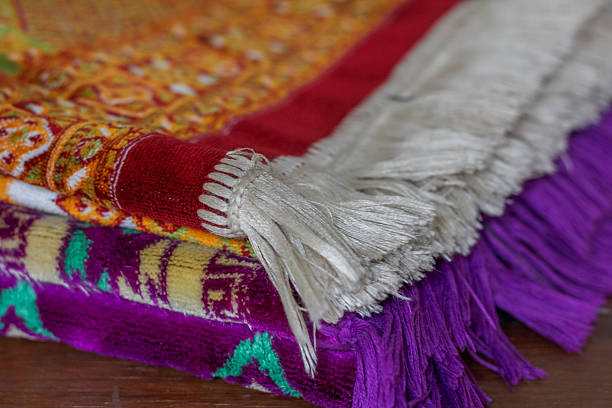 Colorful Anatolian kilim decorated with diamond and stripe motifs in red, yellow, white, and blue. The flatwoven carpet highlights cultural textile heritage and traditional craftsmanship.