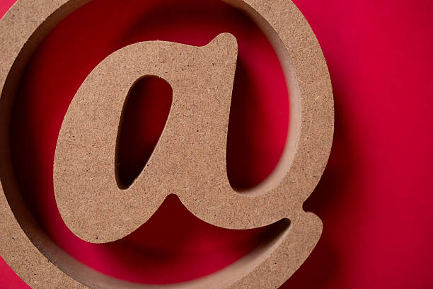 At sign on a red background
