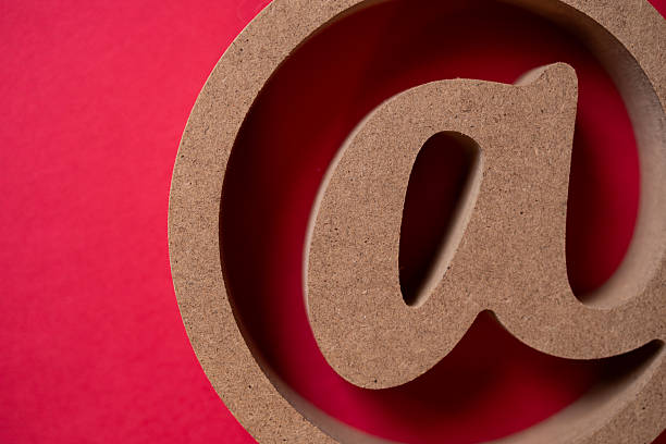 At sign on a red background