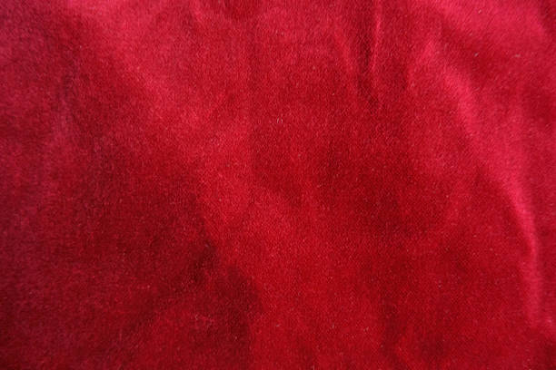 istock Background - red velour cotton fabric from above 2251305653