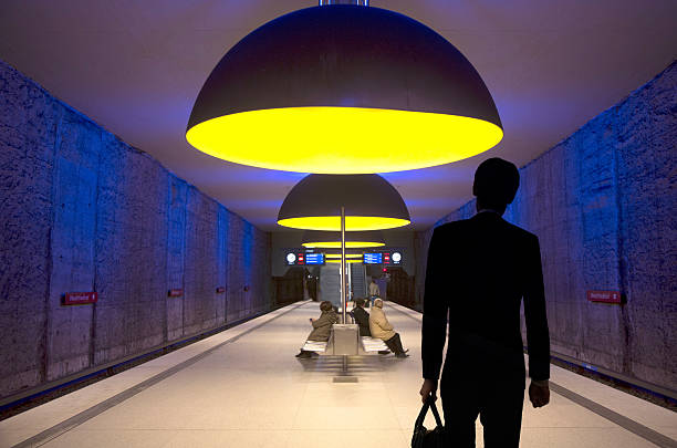 Germany Munich.    businessman taking the Munich subway at  Westfriedhof station