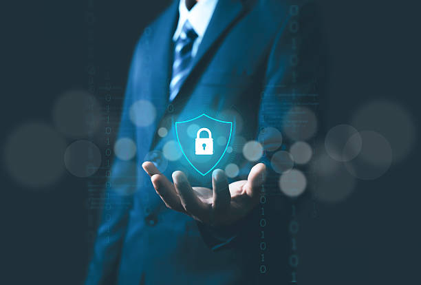 istock This image represents cybersecurity, showing shield and key symbols on a businessman's hand within a digital background, emphasizing the necessity of protecting data and systems from online attacks. 2251306392