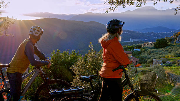istock Mature couple with e-bicycles on rural hilltop 2251306623