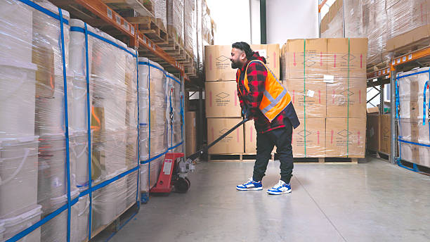 istock Maori man using a pallet jack in a warehouse 2251307401