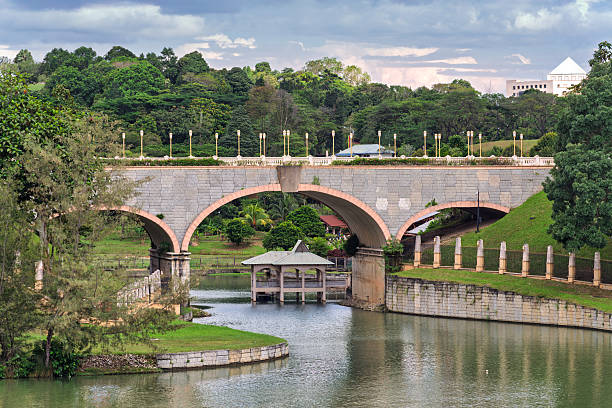 istock Seri Gemilang Bridge, a stone arch bridge, spanning across water with surrounding greenery in Putrajaya, Malaysia. 2251309149