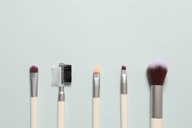 istock Cosmetic brushes on colored background. Set of makeup brushes 2251310107