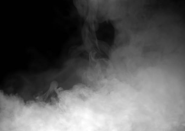 istock Dense white smoke drifting on a dark background creates a dramatic atmospheric texture, ideal for design overlays, cinematic effects, and creative compositions needing mist, fog, or vapor elements. 2251310548