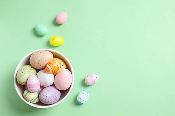 istock Happy Easter. Colorful eggs on color background, space for text or advertising 2251312176