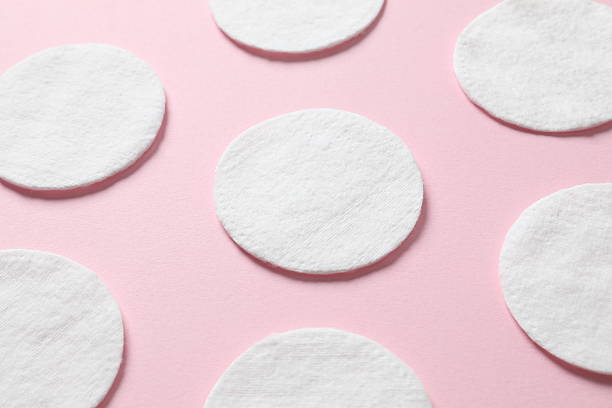 istock Cotton pads on a color background, top view. Flat lay. 2251312597