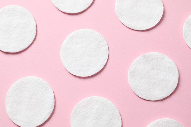 istock Cotton pads on a color background, top view. Flat lay. 2251312598