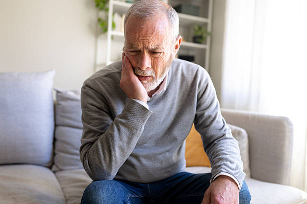 istock Senior man feeling sad and depressed at home 2251314344