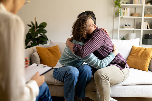 istock Couple hugging during marriage counseling session 2251314465