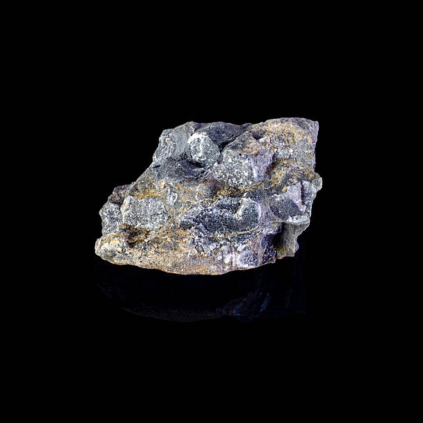 istock Close-up of a unique rock formation against a stark black background 2251315565