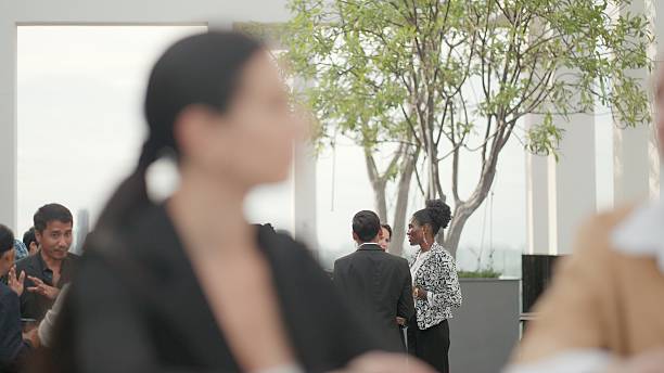 istock Business professionals from different industries meet at a networking event to discuss innovative strategies, evaluate investment options, and build meaningful connections that support long-term success. Group of business people at a business seminar. 2251315714