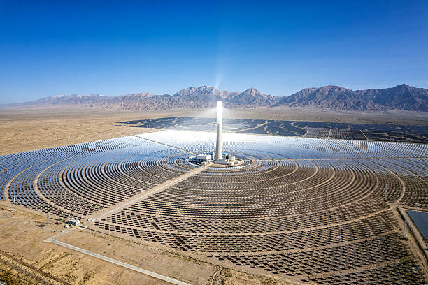 istock Concentrated Solar Power Tower and Mirror Field from Above 2251316522