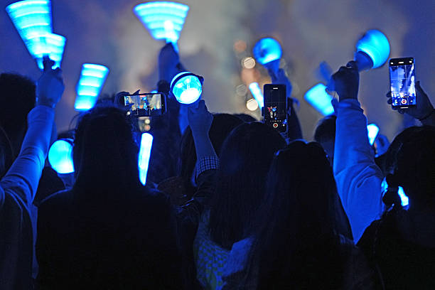 istock The audience enthusiastically waved glow sticks 2251320409