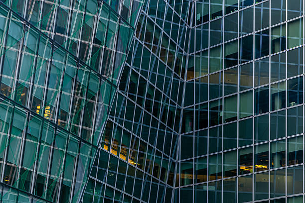 istock Modern Glass Architecture With Reflective Facade And Geometric Structural Lines 2251320801