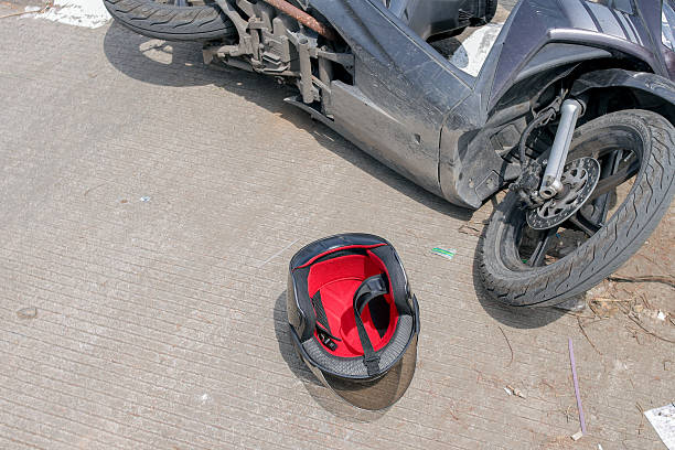 istock Motorcycle Accident Aftermath Showing Fallen Bike With Helmet 2251323974