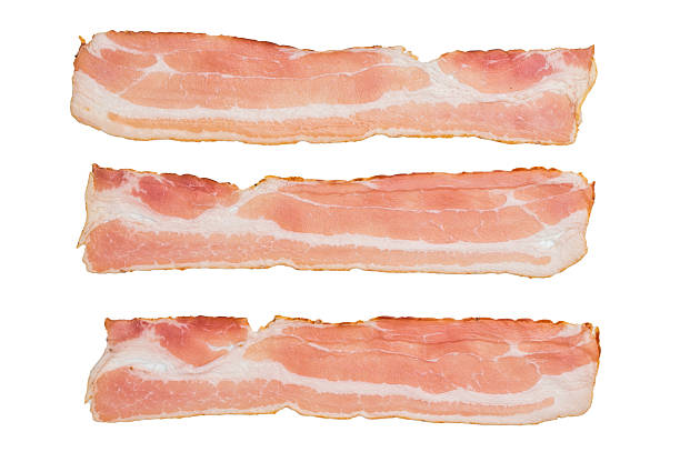 istock Fresh uncooked bacon rashers thin strips charcuterie ingredient on clean white backdrop ready for cooking or food styling 2251324211