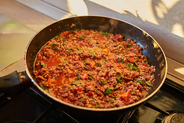 istock Spaghetti bolognese sauce being fried on a pan 2251325782