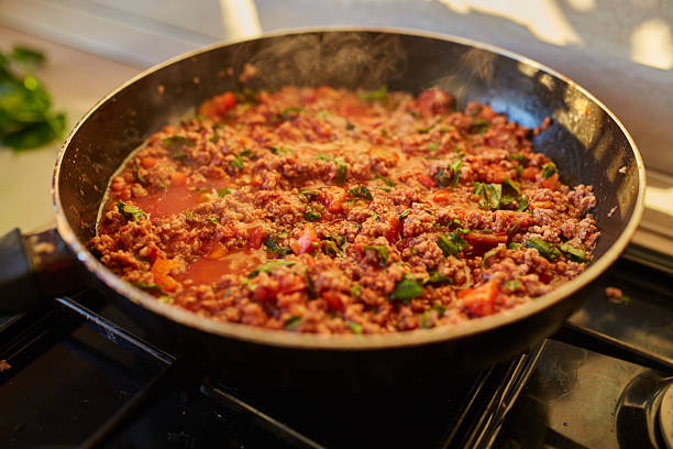 istock Spaghetti bolognese sauce being fried on a pan 2251325801