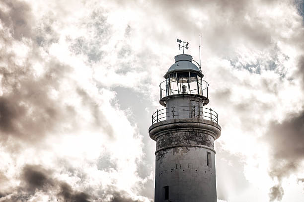 Lighthouse head shrouded my dark moody mammatus clouds
