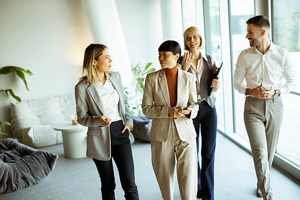 istock Business professionals discussing ideas in modern office setting during daytime 2251331512