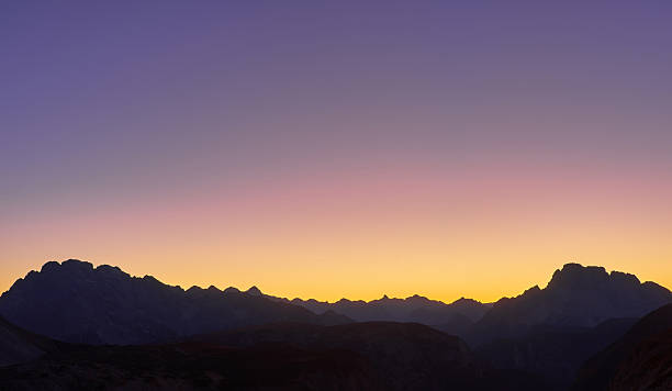 Tre Cime di Lavaredo, sunset scene, illuminated by red light, Dolomites, Italy