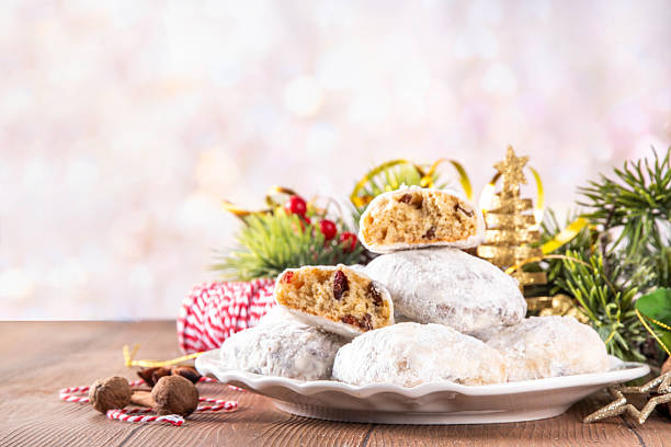Homemade Christmas stollen bites, miniature, bite-sized versions of traditional Christmas fruit cake bread, chocolate and vanilla stollen cookies biscuits with dried fruits, nuts, marzipan, spices