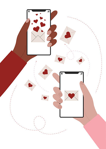istock Two hands holding phones and sending love messages each other. 2251335209