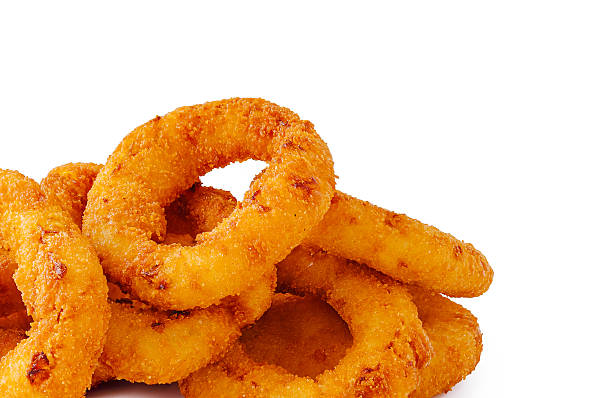 istock Crispy onion rings piled on a white background ready to eat 2251336704