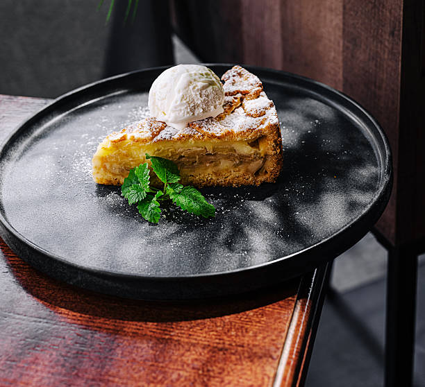 A fresh baked homemade apple pie on the old wooden table