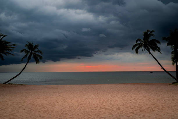 istock Dramatic Storm Clouds Over a Tropical Beach at Sunset in Vietnam 2251340802