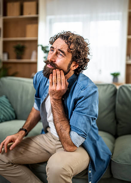 istock Bearded man suffering from severe painful toothache at home 2251341400
