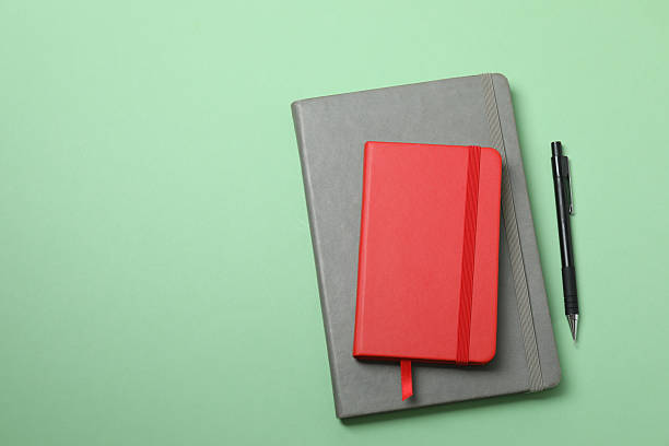 istock PNG, Notebooks with pens, isolated on green background 2251342300