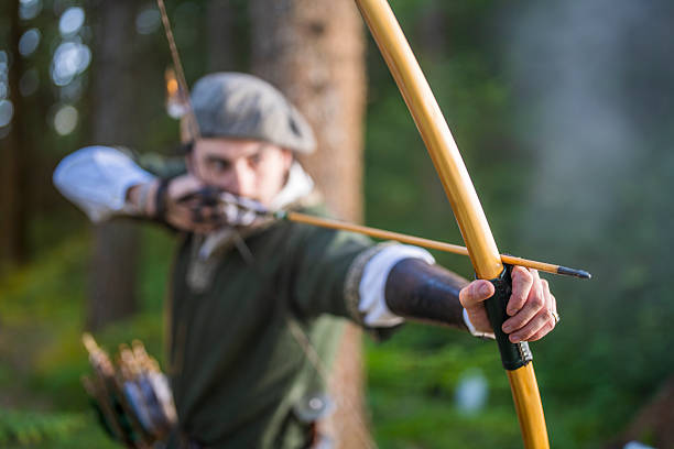 istock Young Caucasian Archer in Forest Focused on Target with Determined Aim 2251342481