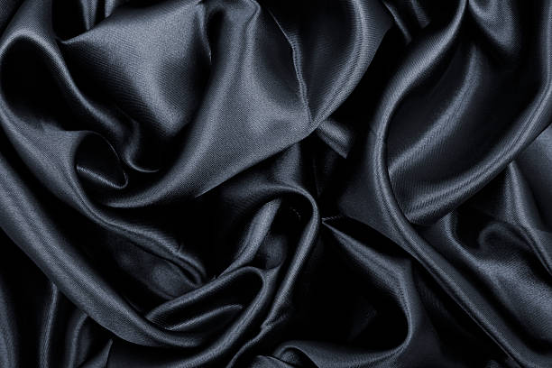 istock Smooth elegant black silk or satin texture as abstract background. Luxurious background design 2251342840