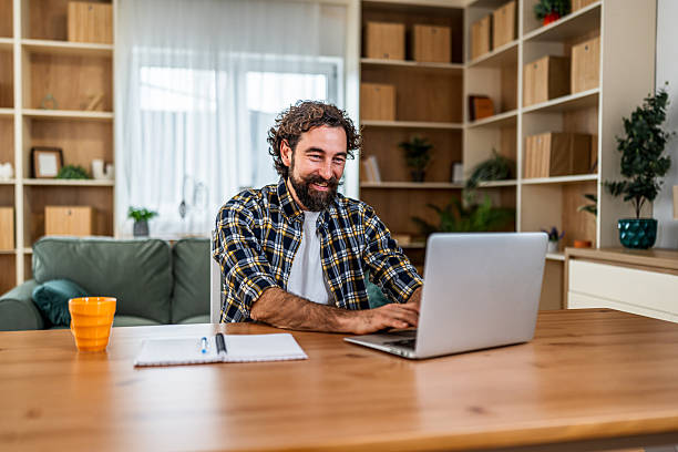 istock Man working from home telecommuting on laptop 2251342887