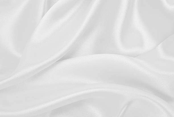 istock Smooth elegant white silk or satin luxury cloth texture as wedding background. Luxurious background design 2251342912