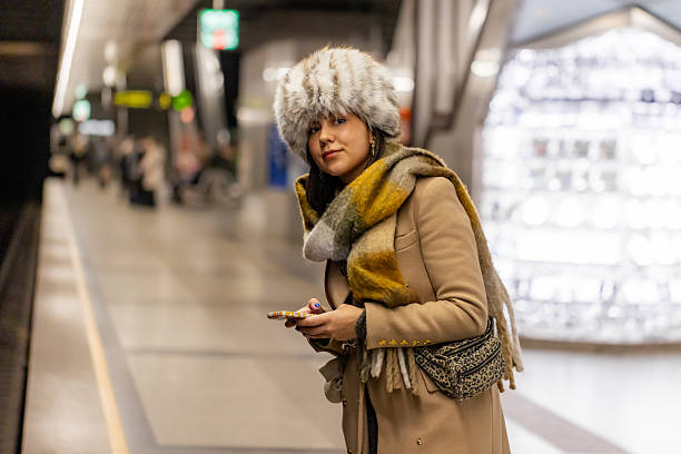 istock Female Traveler Waiting with Mobile Device 2251346391