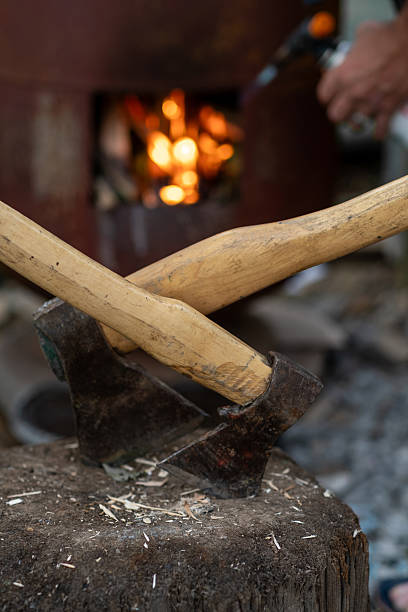 Crafting Tools at a Rustic Workshop With a Focus on Traditional Woodworking and Campfire Ambiance
