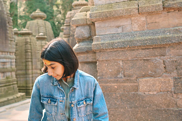 Woman tourist in Temple ruin of the My Son complex, Vietnam. Vietnam opens to tourists again after quarantine Coronovirus COVID 19.