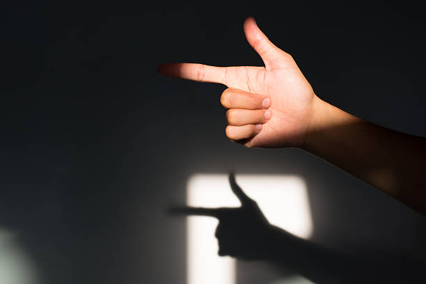A close-up of a hand making a \