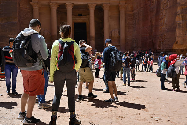 Petra, Jordan - Apr 1, 2015: Tourists visit the Petra's temples, tombs, theaters and other buildings are scattered over 400 square miles. UNESCO world heritage site and one of The New 7 Wonders of the World.